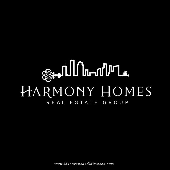 Harmony Homes Real Estate logo with key of the city chic black and white color scheme